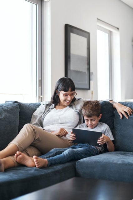 Mother and son on couch